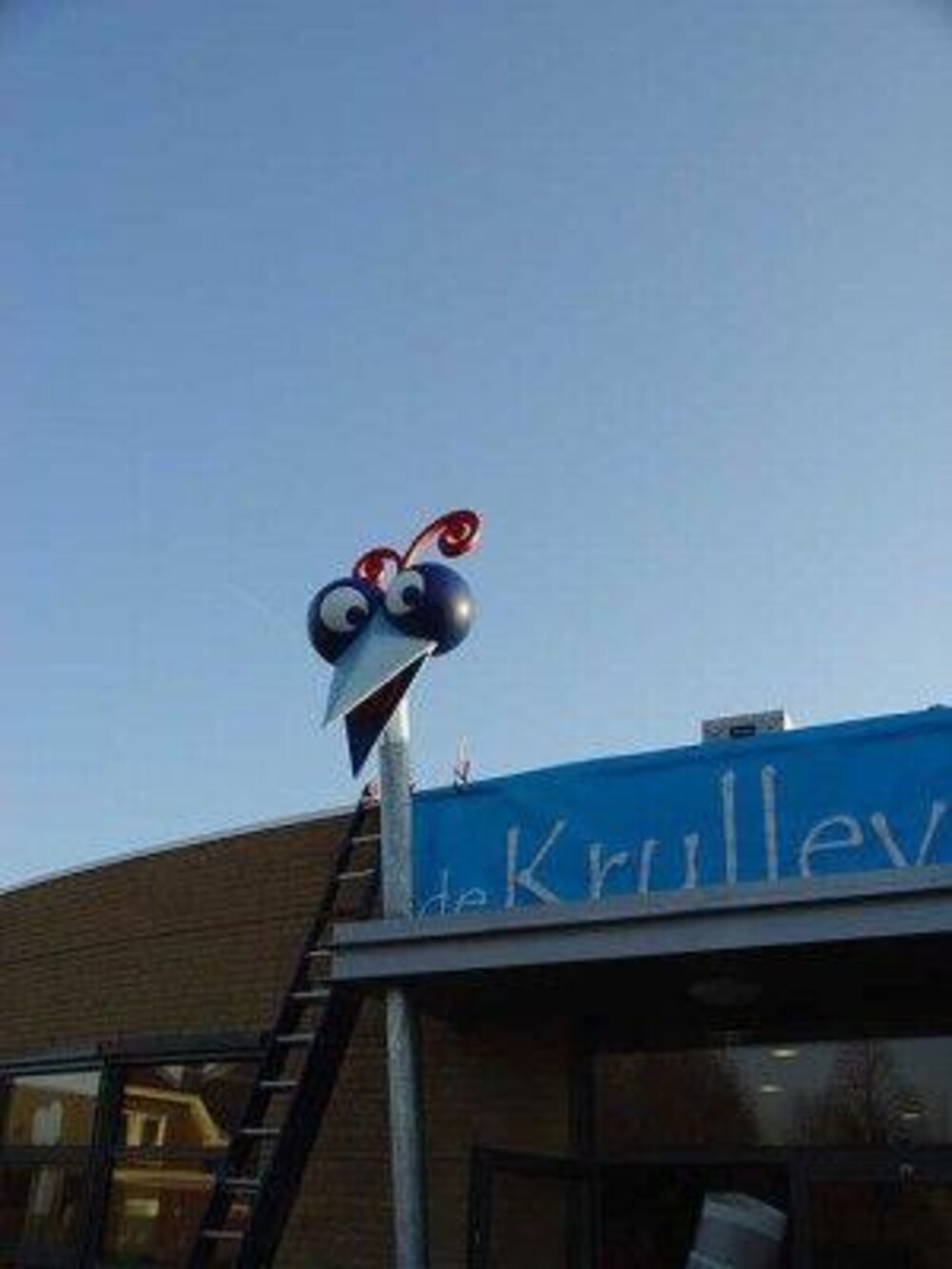 Gevelreclame - Blowups realiseerde de vogelkop van De Krullevaar